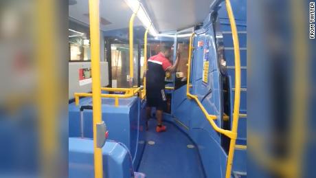 A still from the video taken on a bus in central London, showing a man berating the bus driver.