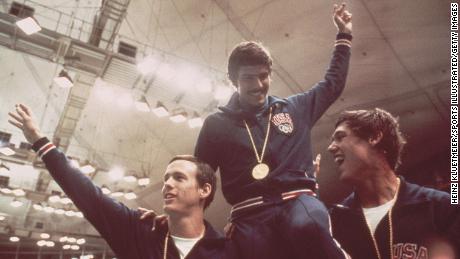 Spitz (center) celebrates relay gold at the 1972 Munich Olympics.