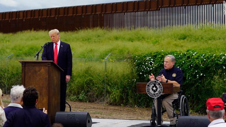 Former President Donald Trump and Texas Gov. Greg Abbott visit an unfinished section of border wall in Pharr, Texas, on June 30.