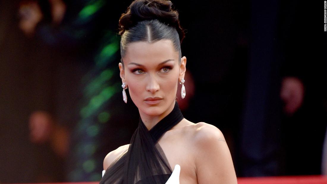Bella Hadid stepped out in a sleek, vintage Jean Paul Gaulter ensemble with cut-out detailing.
