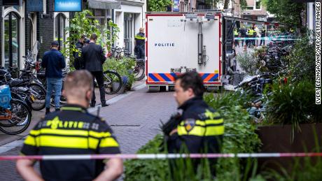 Police respond to the scene of the shooting of Peter R. de Vries in Amsterdam.