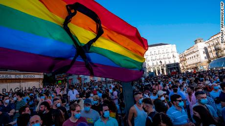 The rainbow flag with a black ribbon flutters during a protest against Luiz&#39;s killing in Puerta del Sol, central Madrid, on Monday, July 5.