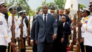 FILE - In this April 7, 2018, file photo, Haiti&#39;s President Jovenel Moise, center, leaves the museum during a ceremony marking the 215th anniversary of revolutionary hero Toussaint Louverture&#39;s death, at the National Pantheon museum in Port-au-Prince, Haiti. Moïse was assassinated after a group of unidentified people attacked his private residence, the country&#39;s interim prime minister said in a statement Wednesday, July 7, 2021. (AP Photo/Dieu Nalio Chery, File)
