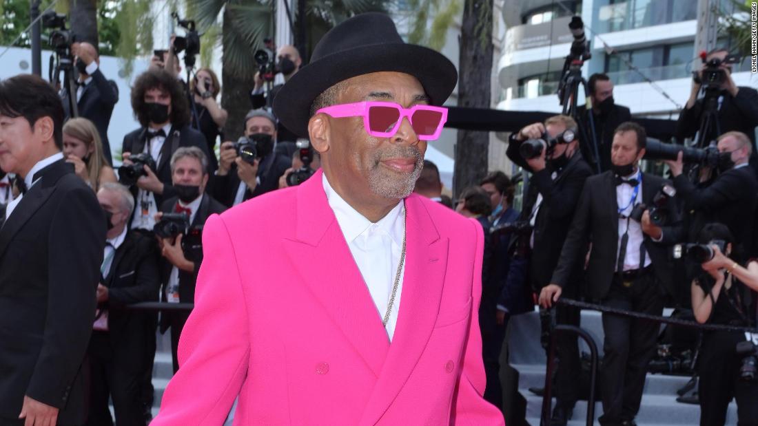 Jury president and American director Spike Lee wore a hot pink Louis Vuitton suit and custom red, white and blue Air Jordan 1 PE sneakers.