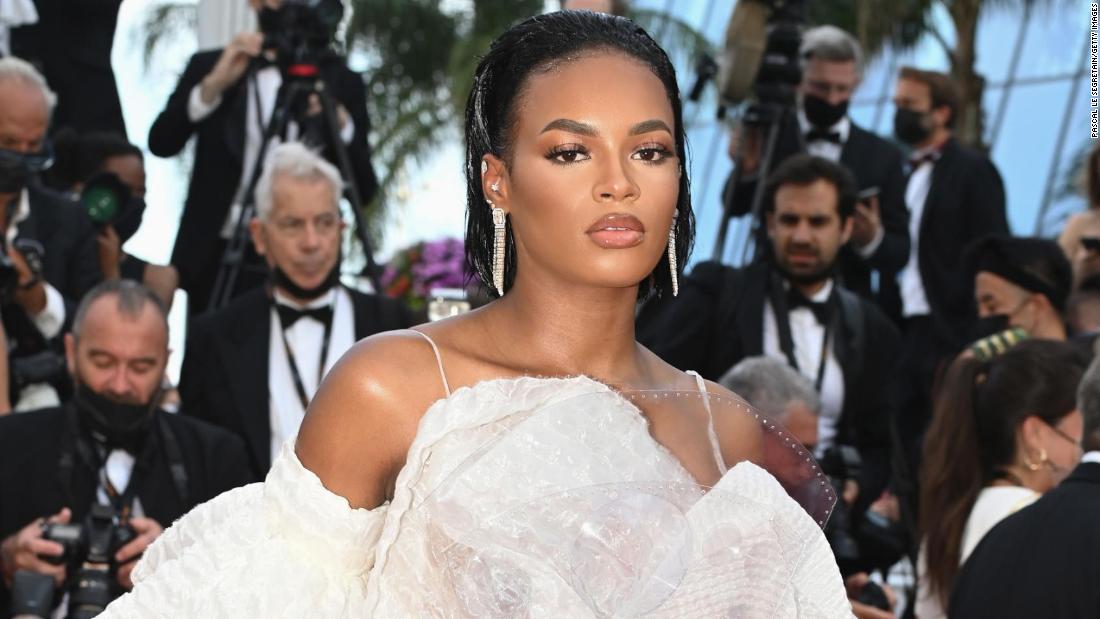 French model Didi Stone Olomide walked the red carpet in an all-white corsetted look.