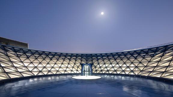 The inverted glass dome offers visitors the chance to gaze at an unobstructed view of the open sky.