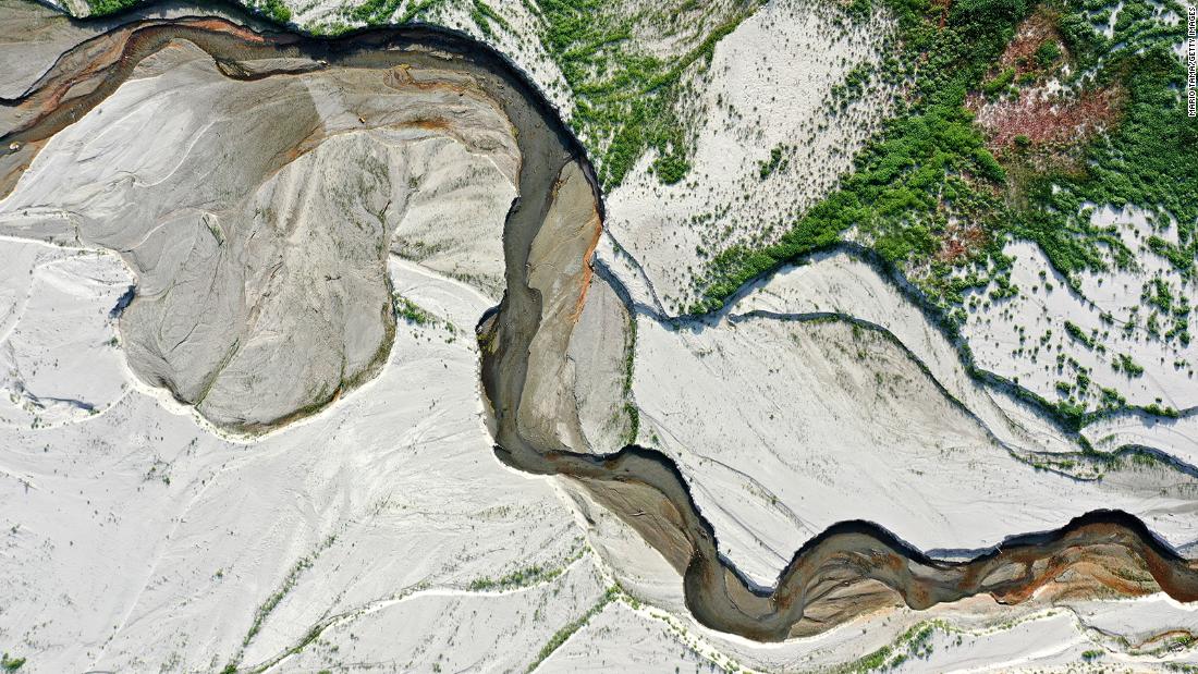 This aerial photo shows the San Gabriel River and the exposed lake bed of the San Gabriel Reservoir near Azusa on June 29.