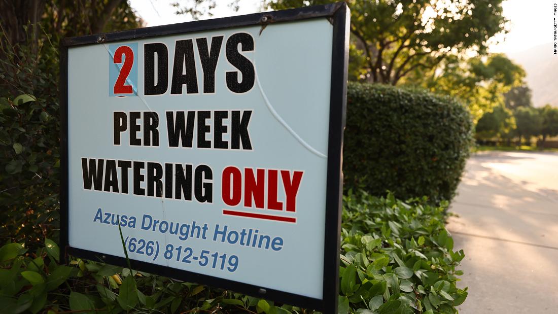 A sign is posted about watering limits in Azusa, California, on June 29.