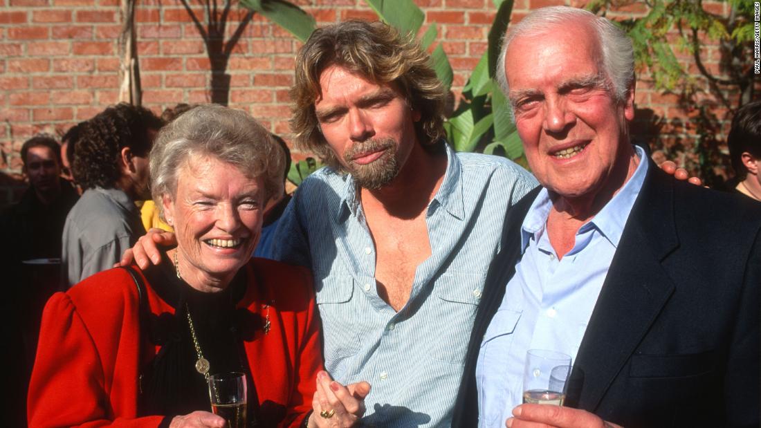 Branson poses with his parents, Eve and Edward, at a reception in Los Angeles in 1991. His mother was a flight attendant and his father was a lawyer.