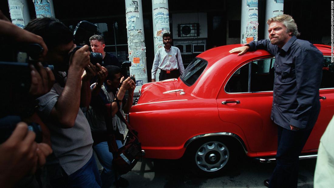 Branson poses for photos in India after launching a direct flight from London to New Delhi in 2000.