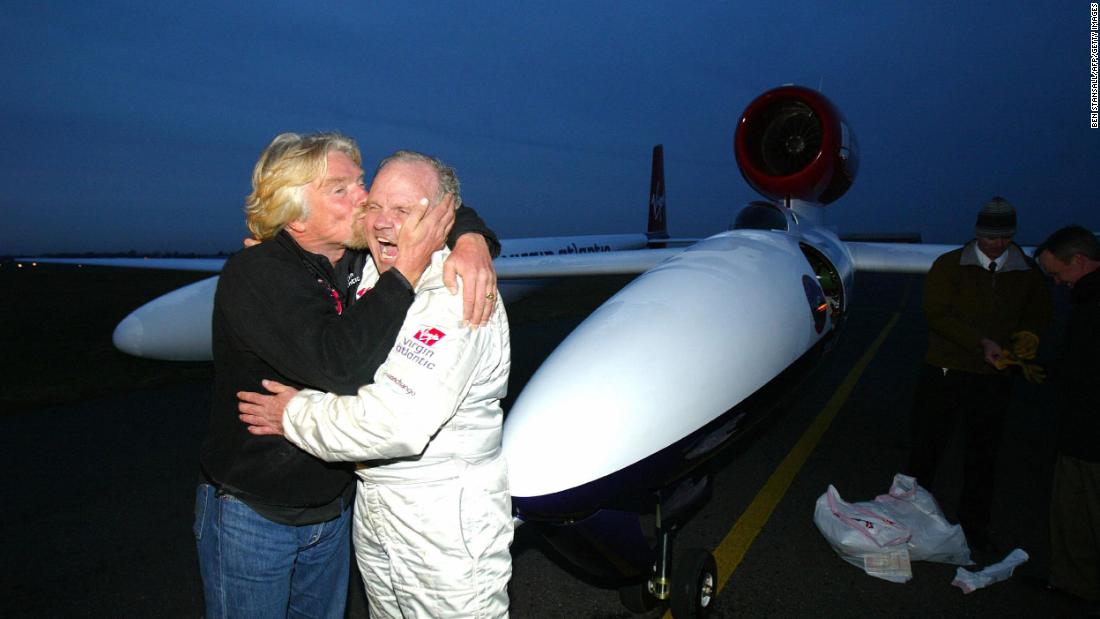 Branson kisses Steve Fossett after Fossett flew the Virgin Atlantic GlobalFlyer for 25,766 miles in 2006. It was the longest nonstop flight in history.