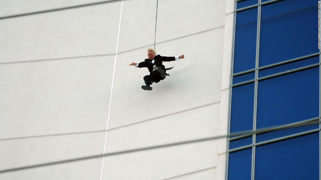 Branson jumps off the roof of the Palms hotel in Las Vegas as part of a publicity stunt for his Virgin America airline in 2007.