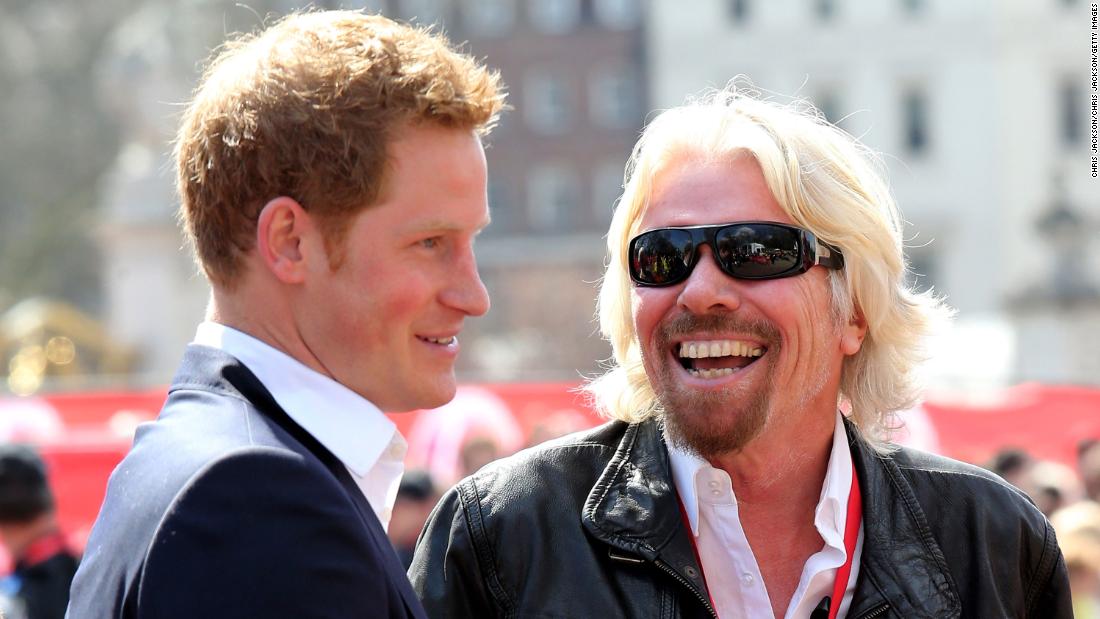 Branson chats with Britain&#39;s Prince Harry at the finish of the London Marathon in 2013. Virgin has been sponsoring the event for years.