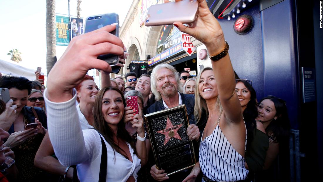 People take selfies with Branson after he received a star on the Hollywood Walk of Fame in 2018.