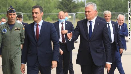 Spanish Prime Minister Pedro Sanchez, second left, and Lithuanian President Gitanas Nauseda, third from right, arrive for a press conference after their meeting at Siauliai Air Base in Lithuania, on Thursday.