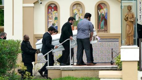Pallbearers carry the shared casket of sisters Lucia and Emma Guara before their family&#39;s funeral service in Miami Beach on July 6.