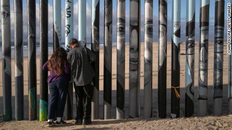 Faces of people deported from the United States are painted on the fence at Friendship Park, which is located in both sides of the border. 