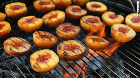 Grill peaches to bring out a sweet and smoky flavor.