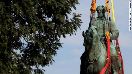 CHARLOTTESVILLE, VIRGINIA - JULY 10: Workers remove a statue of Confederate General Robert E. Lee from Market Street Park July 10, 2021 in Charlottesville, Virginia. Initial plans to remove the statue four years ago sparked the infamous &quot;Unite the Right&quot; rally where 32 year old Heather Heyer was killed. A statue of Confederate General Thomas &quot;Stonewall&quot; Jackson in the Charlottesville and Albemarle County Courthouse Historic District is also scheduled to be removed this weekend.  (Photo by Win McNamee/Getty Images)