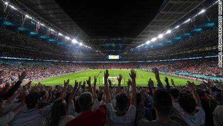 England fans cheer during the semifinal against Denmark at Wembley Stadium on July 7, 2021.