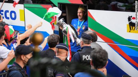 Chiellini exits the bus as the team arrives at the Parco dei Principi hotel after winning the European Championship.