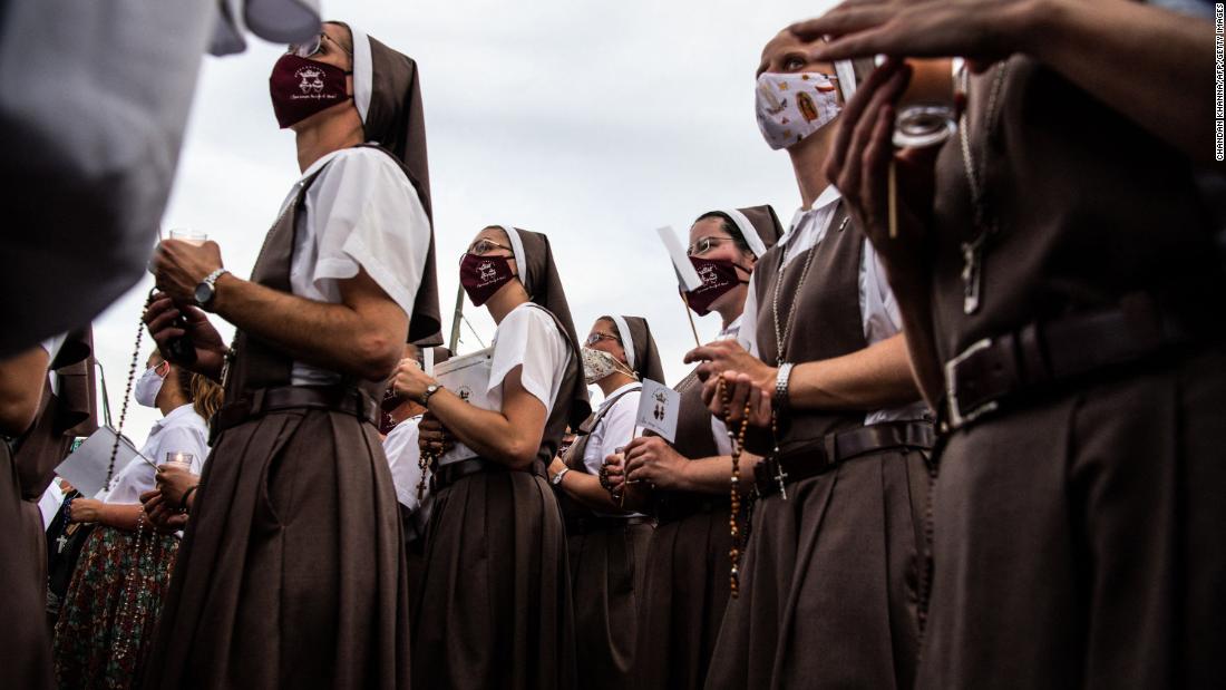 Nuns from the St. Joseph&#39;s Catholic Church pray at the memorial site on July 7.