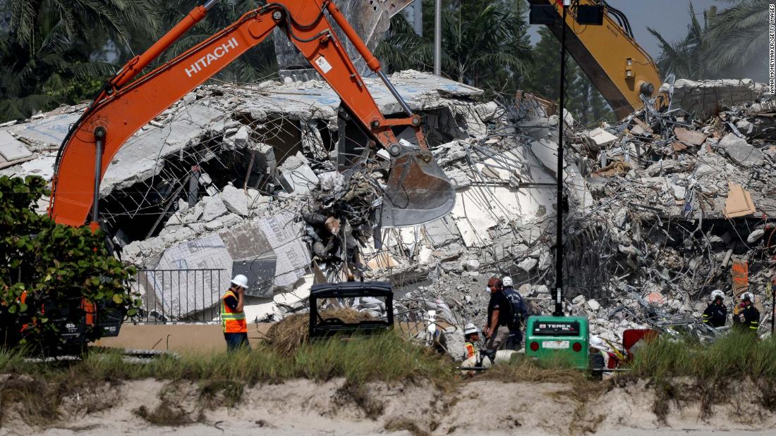 Excavators dig through the remains from the Champlain Towers South building on July 9.