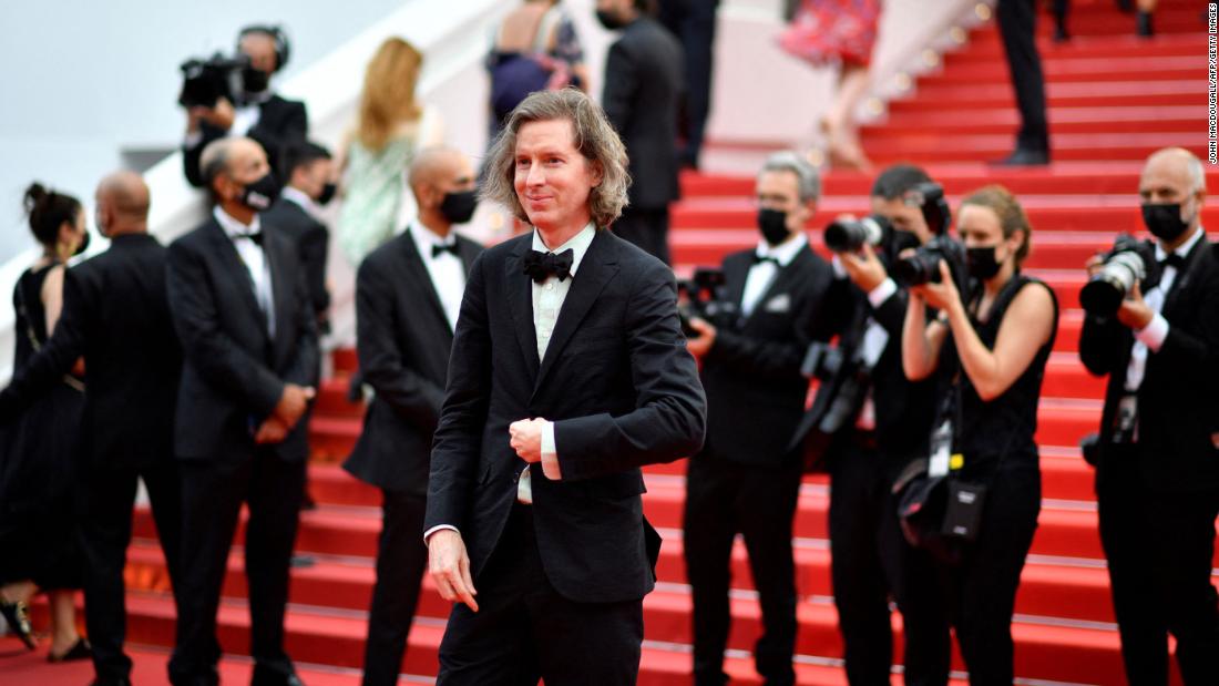 Director Wes Anderson wore a black tux and pastel green shirt.