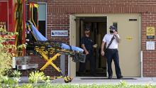 Emergency personnel wear face masks to help prevent the spread of COVID-19 while leaving an hospital clinic emergency room during a new coronavirus pandemic, Wednesday, March 24, 2021, in Orlando, Fla. (Phelan M. Ebenhack via AP)