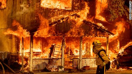 Fire consumes a home as the Sugar Fire, part of the Beckwourth Complex Fire, tears through Doyle, California, on Saturday, July 10, 2021. 