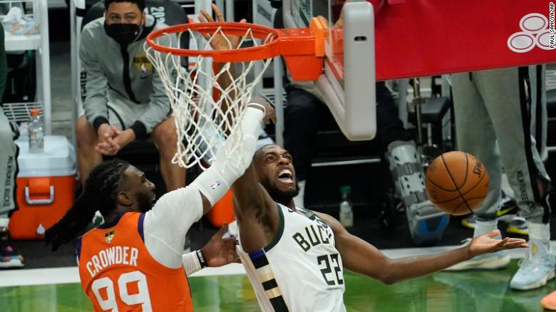 Milwaukee Bucks forward Khris Middleton (22) drives around Phoenix Suns forward Jae Crowder (99) during the second half of Game 4 of basketball&#39;s NBA Finals.