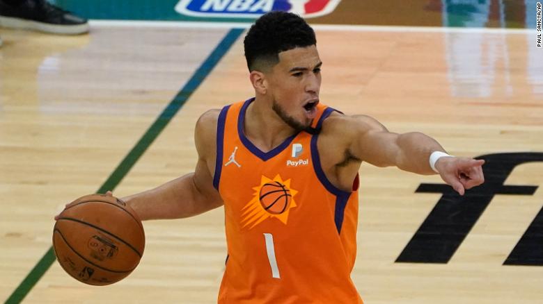 Phoenix Suns guard Devin Booker (1) directs teammates during the first half against the Milwaukee Bucks in Game 4.