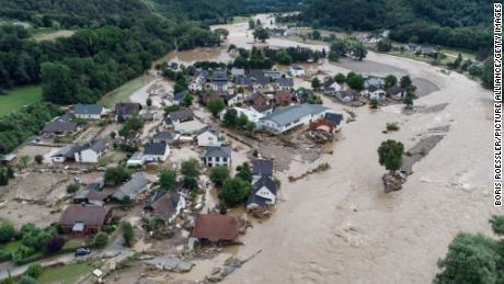 European officials say &#39;climate change has arrived&#39; as deadly floods engulf entire towns