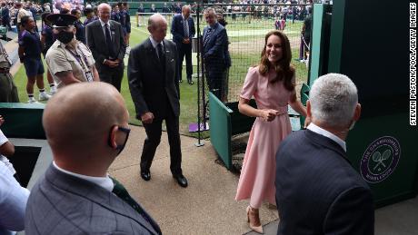 Kate leaves Centre Court at Wimbledon during finals weekend.