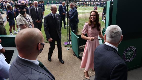 Kate leaves Centre Court at Wimbledon during finals weekend.