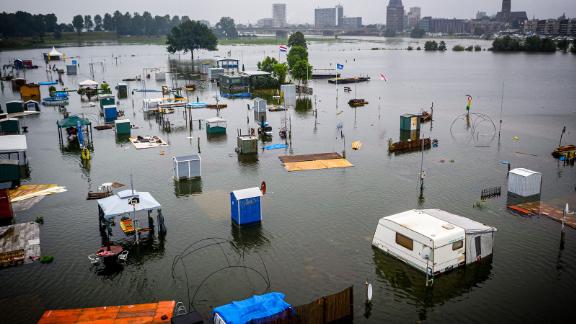 Caravans and campers are partially submerged in Roermond, Netherlands.