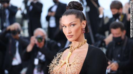Bella Hadid poses as she arrives for the screening of the film &quot;Tre Piani&quot; (Three Floors) at the 74th edition of the Cannes Film Festival in Cannes, southern France, on July 11, 2021.