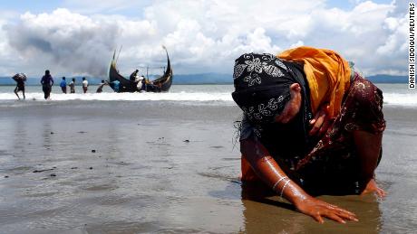 Danish Siddiqui won a Pulitzer Prize for his work on the Rohingya refugee crisis.  This photo shows a Rohingya woman touching the shore after crossing the border between Bangladesh and Myanmar.