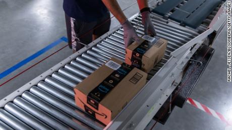Amazon, Walmart and others are racing to staff warehouses and offering extra perks to workers.