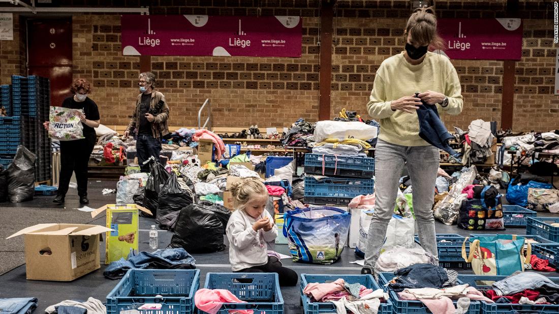 A woman sorts through clothing at a shelter in Liege, Belgium, on Friday.