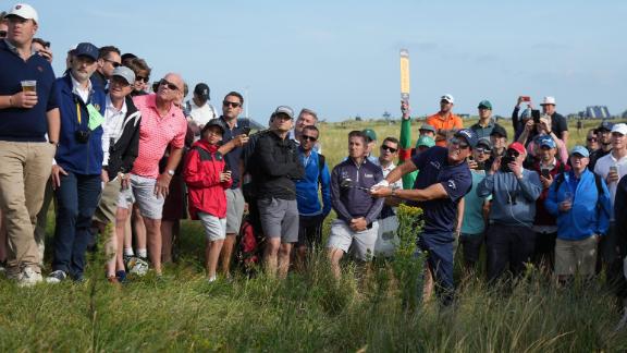 Mickelson plays a shot from the rough on the 12th hole at Royal St George's.