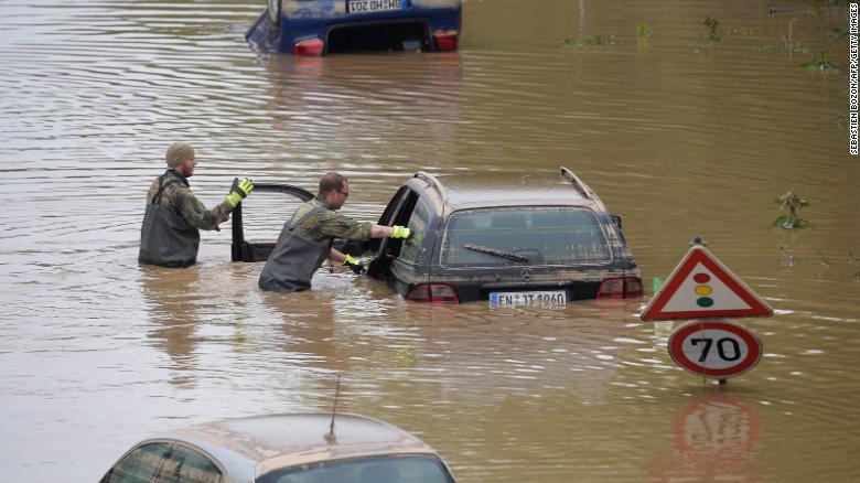 Soldiers of the Bundeswehr, the German armed forces, search for flood victims in submerged vehicles on the highway in Erftstadt, western Germany, on July 17.