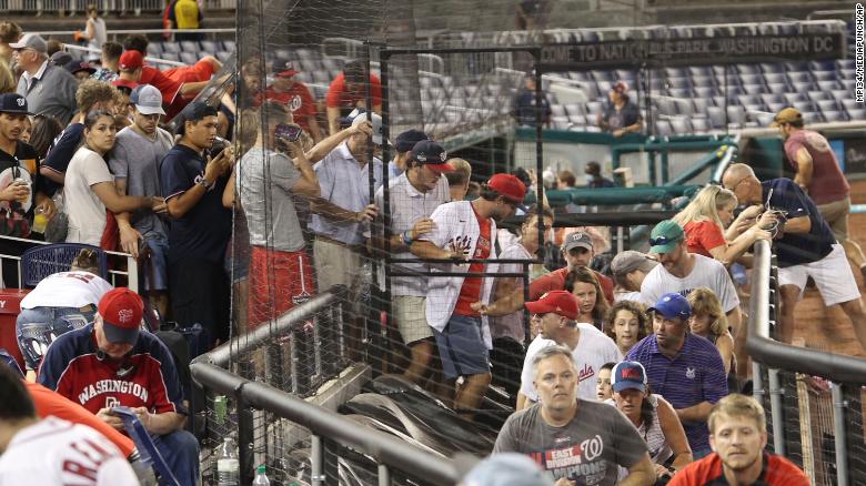 Fans leave their seats after a shooting outside Nationals Park during an MLB game in Washington, DC, on Saturday.