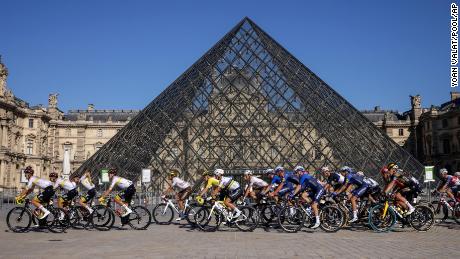Wearing the yellow jersey, Pogaca rides in front of The Louvre Museum on Sunday, July 18.