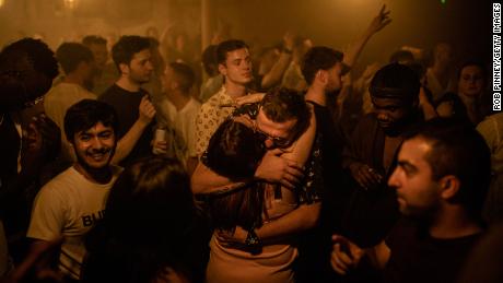 Two people hug at the Egg nightclub in London early Monday. 