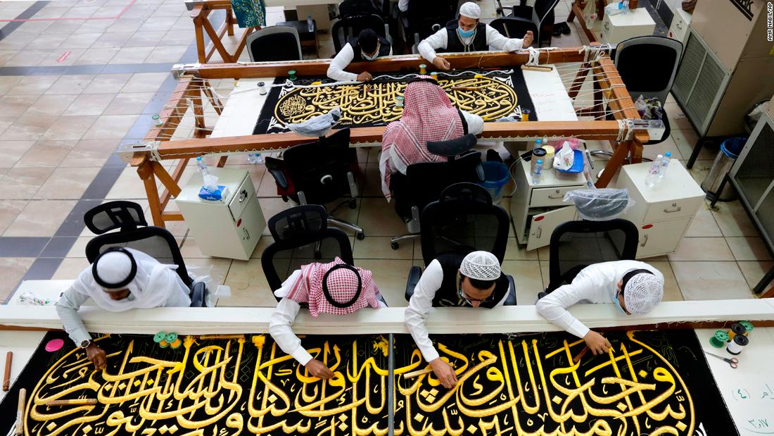 Saudi workers embroider Islamic calligraphy, using either pure silver threads or silver threads plated with gold, as they prepare the Kiswa, or drape, that covers the Kaaba during Hajj.