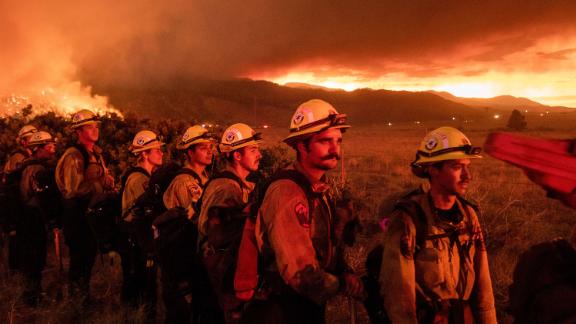 Firefighters monitor the Sugar Fire in Doyle, California, on July 9.