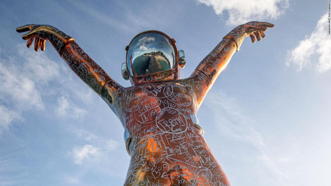 A 22-foot spaceman sculpture has landed in the Caribbean Sea