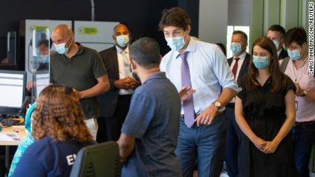 Canada&#39;s Prime Minister Justin Trudeau greets people as he visits a vaccination site in Montreal, Quebec, Canada on July 15, 2021. 