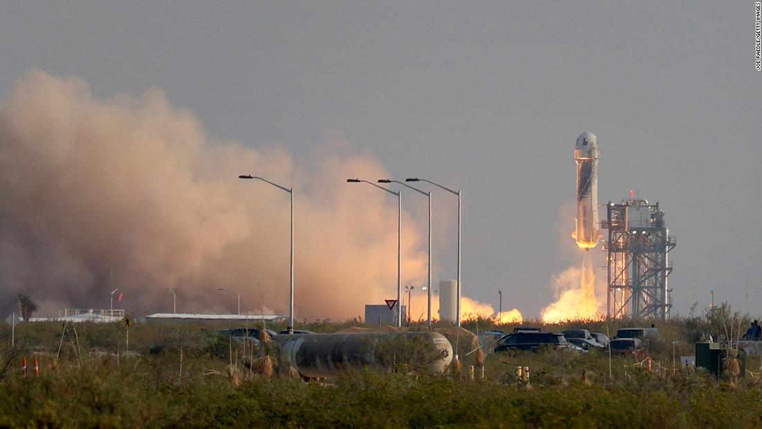 The rocket lifts off from the launchpad.